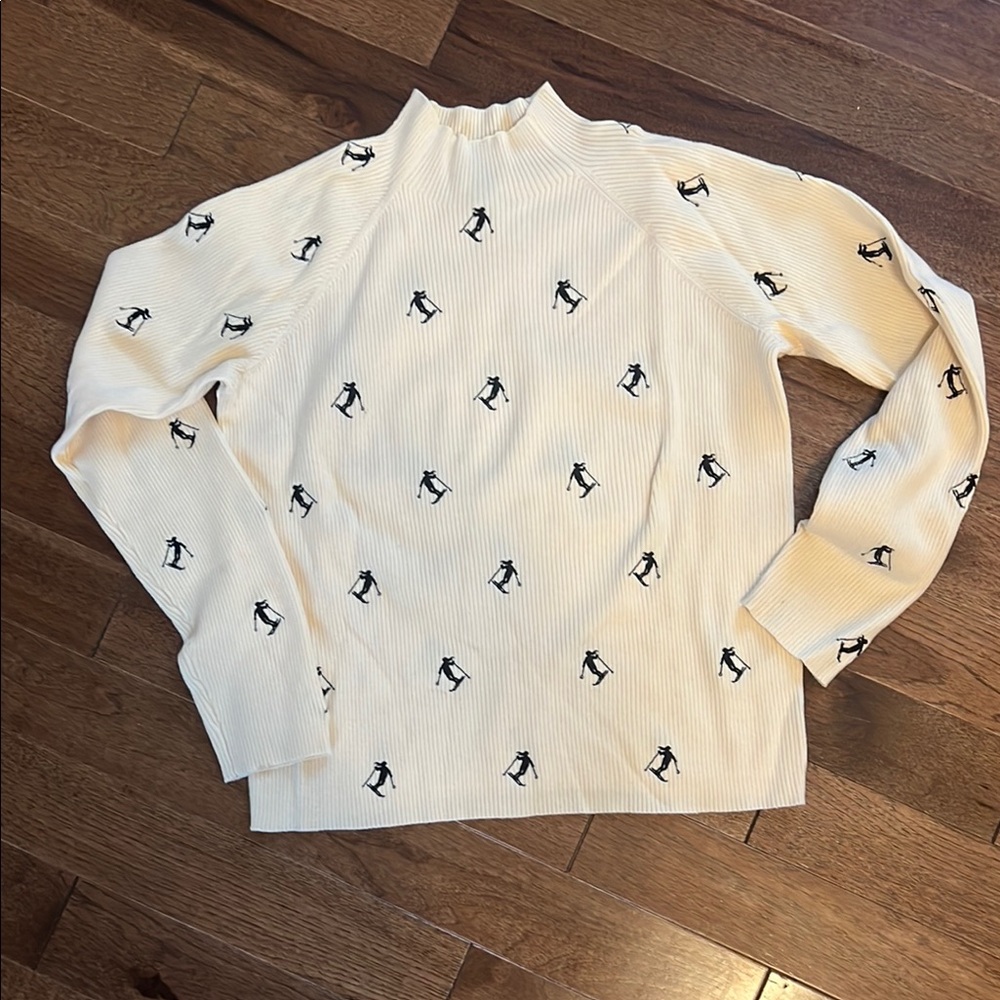 Cream mock neck Sweater with Black skier embroidery pattern